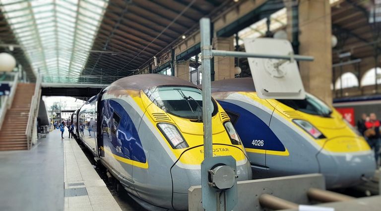 Two Eurostar (blue) trains have arrived at the Gare du Nord in Paris